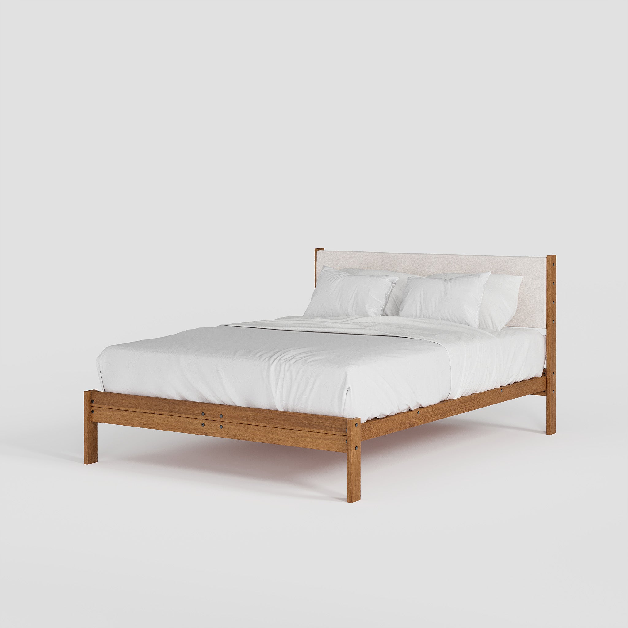 Wooden bed frame with white bedding on a light gray background
