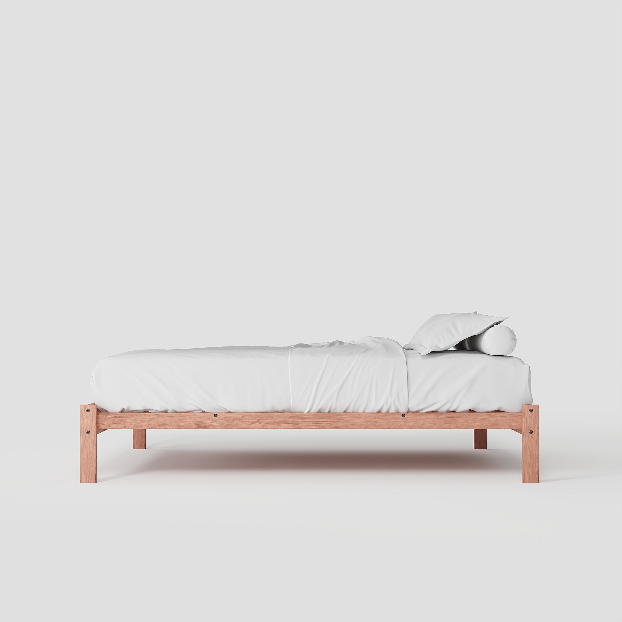Wooden bed frame with white bedding on a light gray background