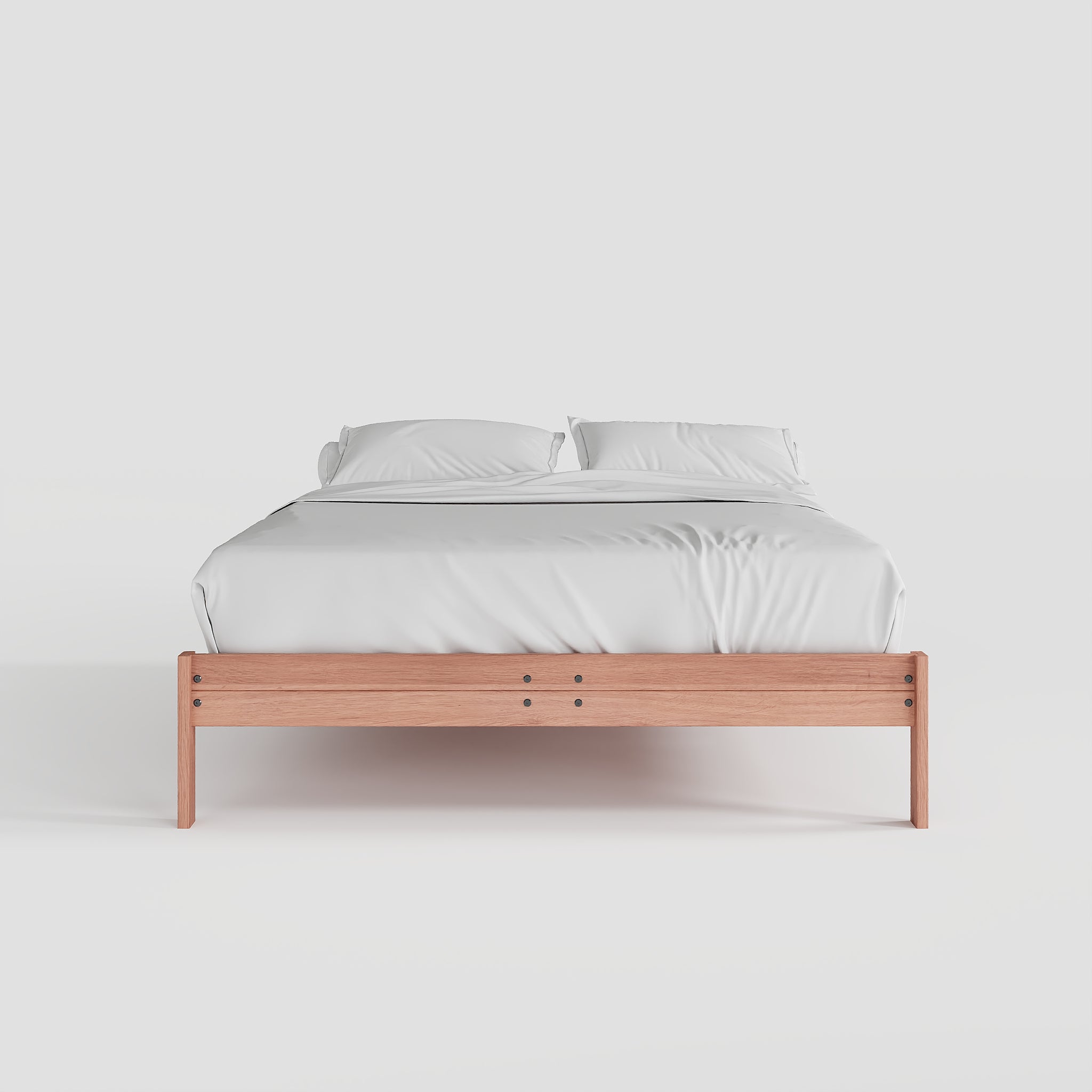 Wooden bed frame with white bedding on a light gray background